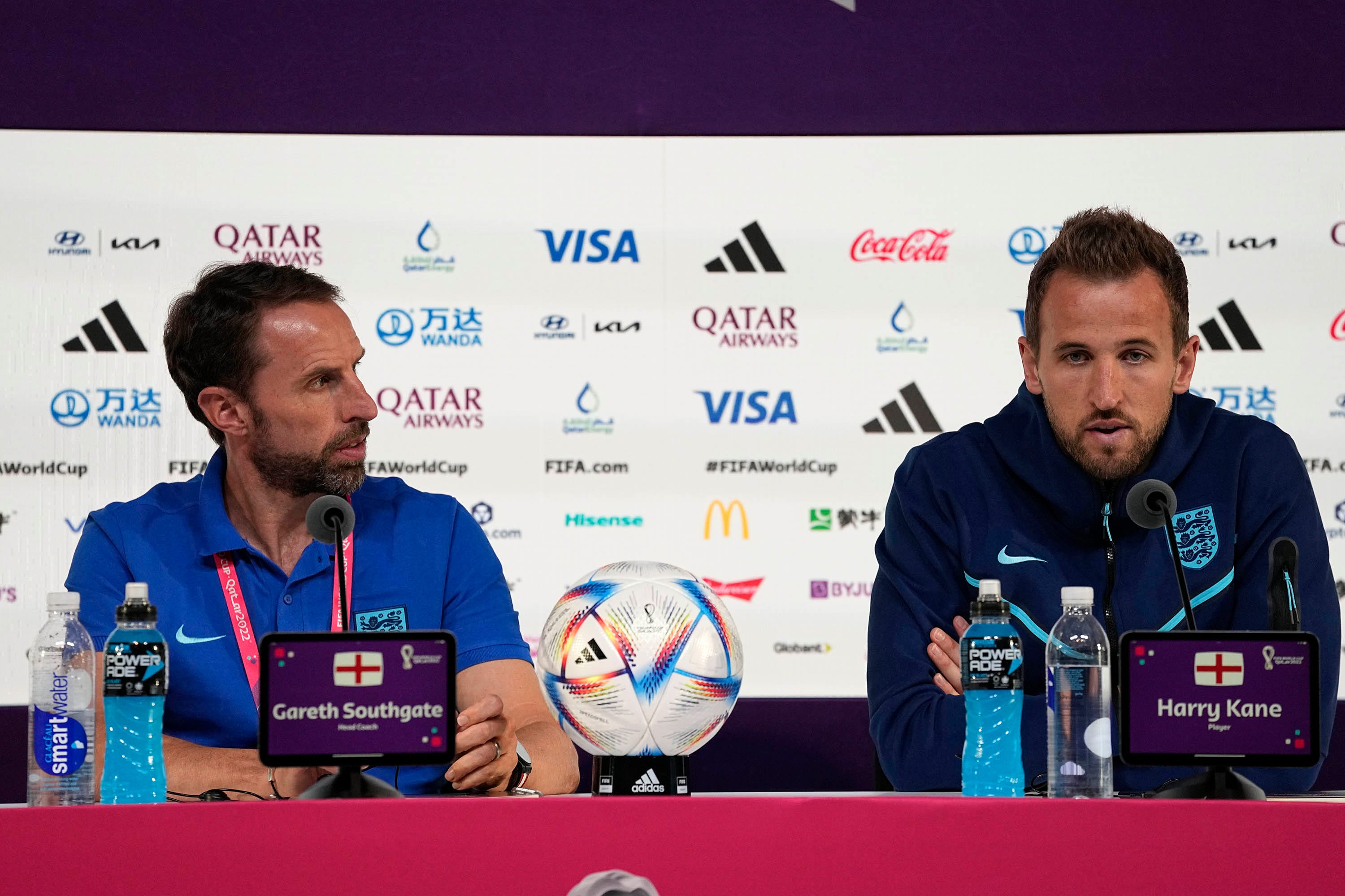 England's head coach Gareth Southgate, left, and Harry Kane speak to the media